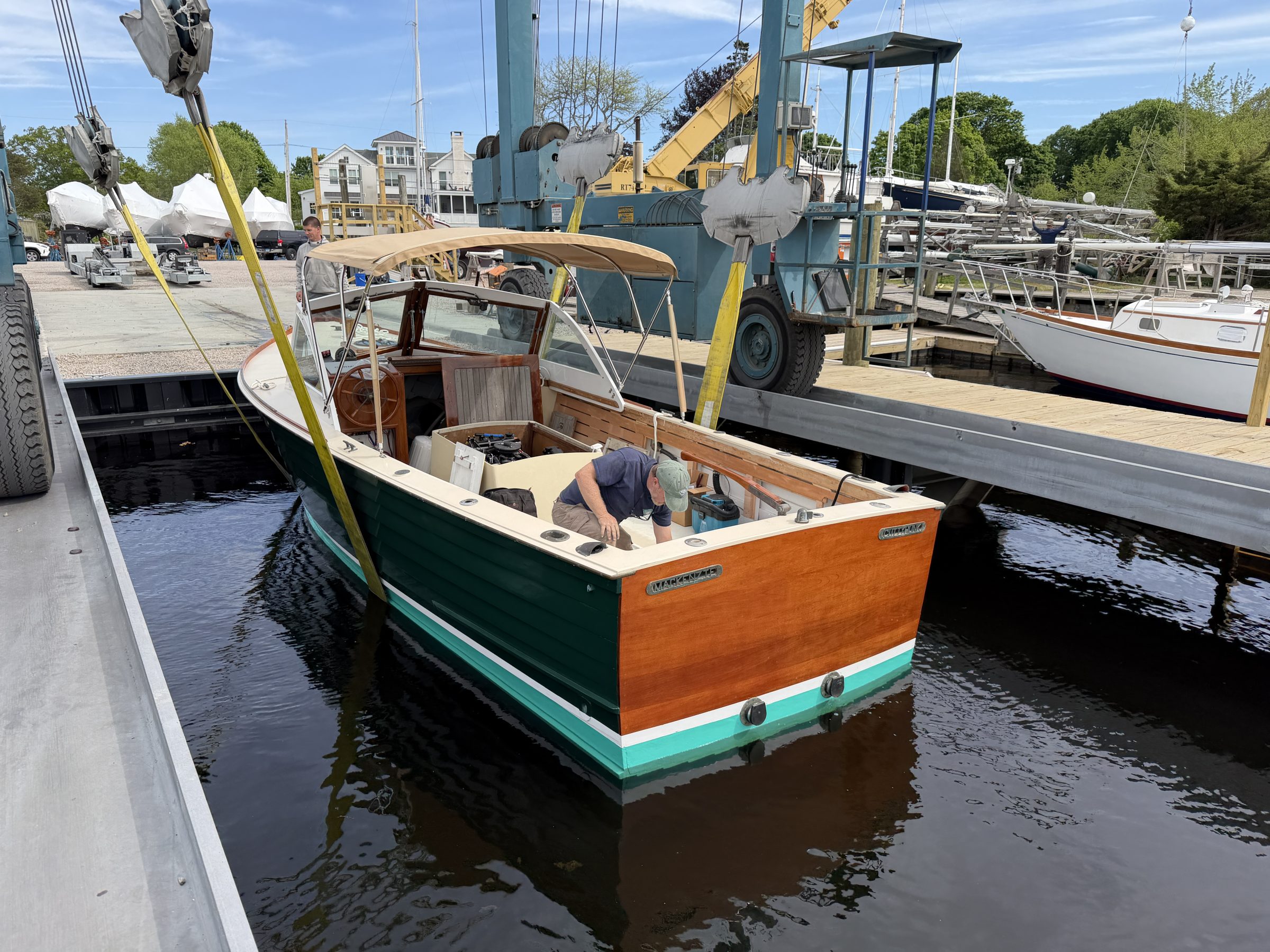 The Frank Hall Boat Yard Travelift lifting a classic wooden yacht